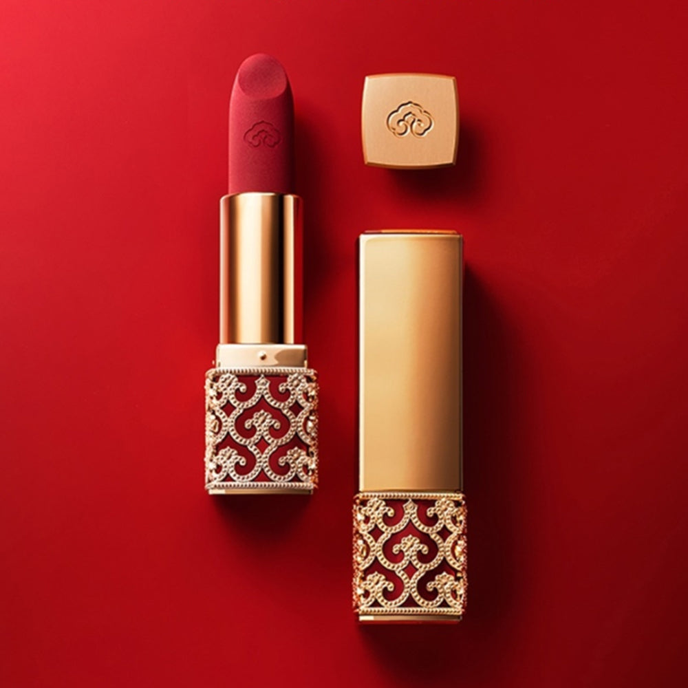 THE WHOO Gong Jin Hyang Mi Velvet Lip Rouge luxury lipstick in elegant red and gold packaging on red background.
