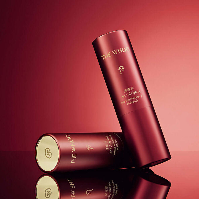 THE WHOO Jin Yul Hang Multi Stick 7g with elegant red packaging on a reflective surface.