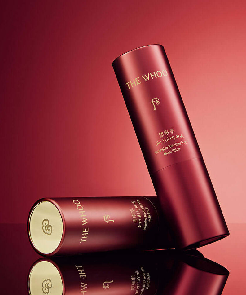 THE WHOO Jin Yul Hang Multi Stick 7g with elegant red packaging on a reflective surface.