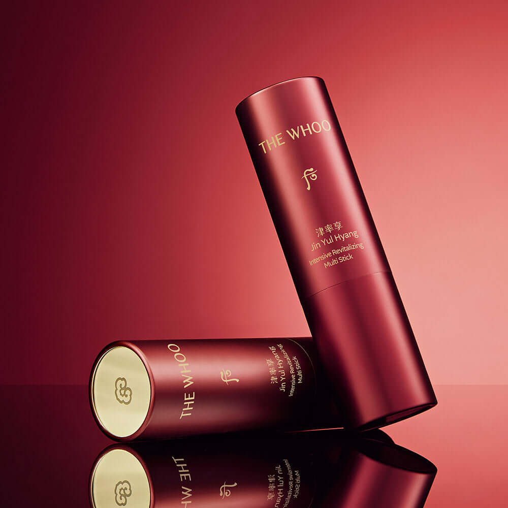 THE WHOO Jin Yul Hang Multi Stick 7g with elegant red packaging on a reflective surface.