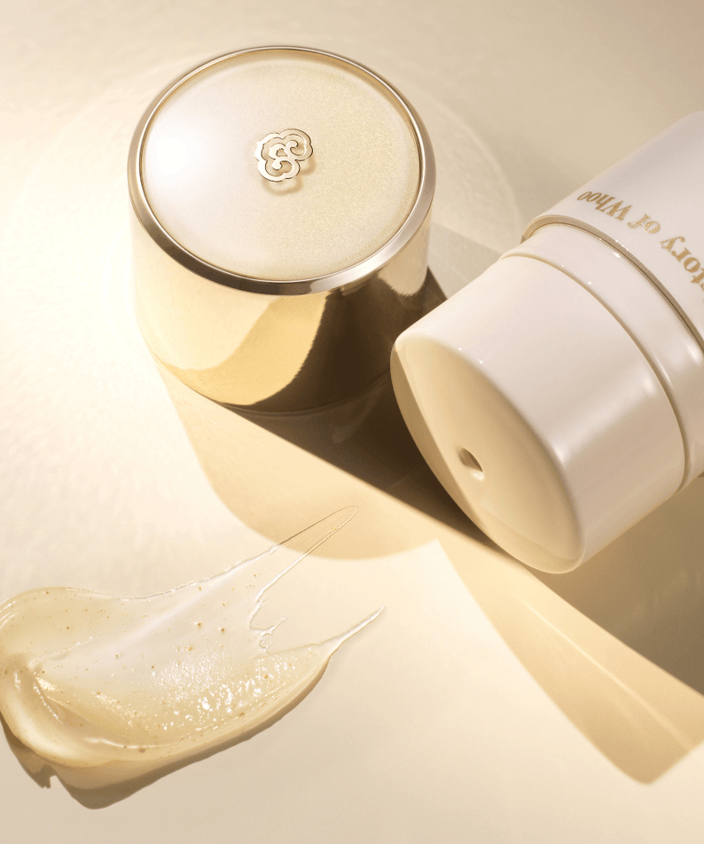 THE WHOO Royal Essential Golden Lip Serine 15ml product packaging with smear of lip serum on a light background