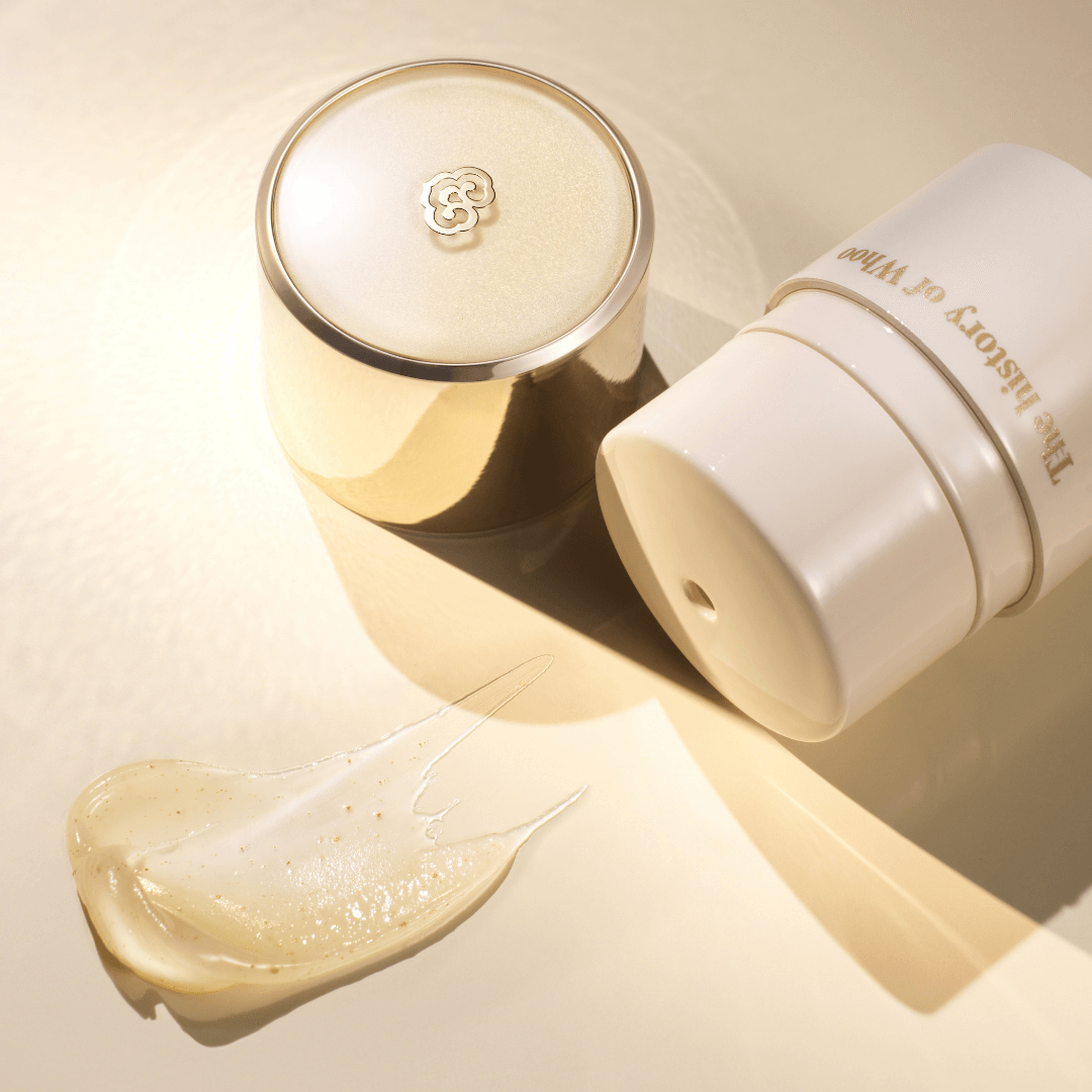 THE WHOO Royal Essential Golden Lip Serine 15ml product packaging with smear of lip serum on a light background