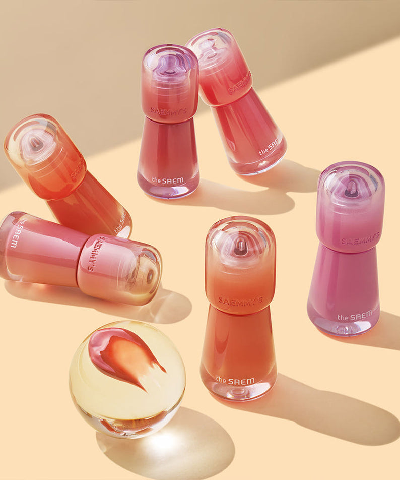 Collection of THE SAEM Saemmy's Aid Shot Tint bottles in various shades displayed on a light surface.