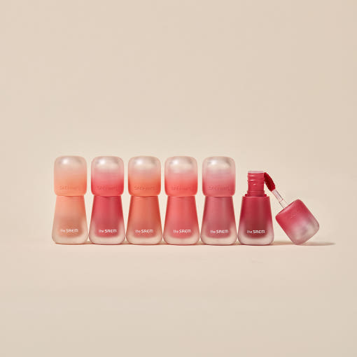 Lineup of six THE SAEM Saemmy's Crema Velvet Tint bottles showcasing different shades on a neutral background.