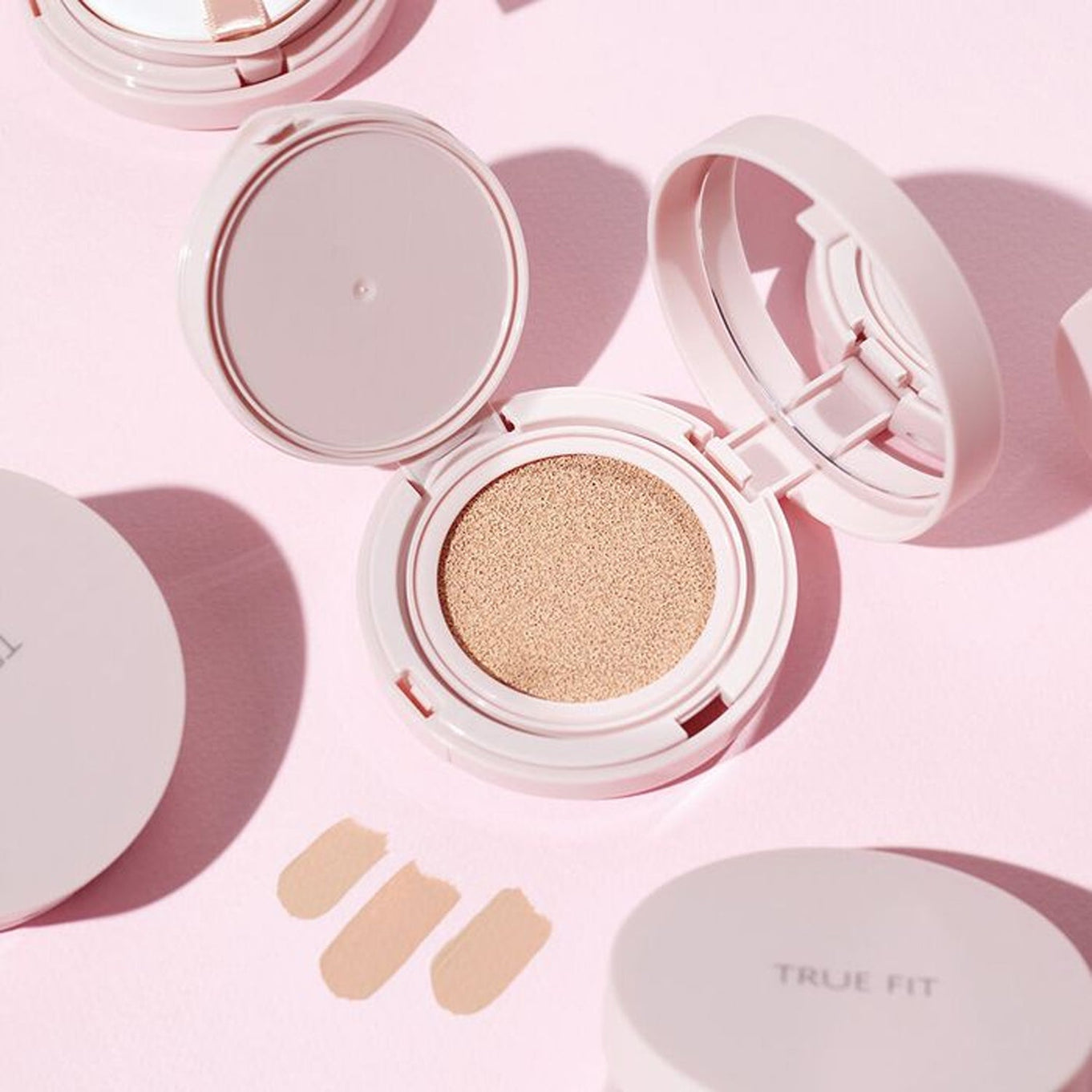 THE SAEM True Fit Glow Cushion in open compact case on a pink background