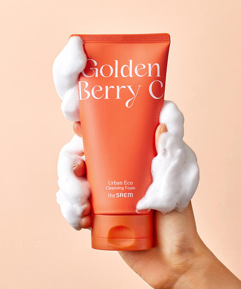 THE SAEM Urban Eco Golden Berry C Cleansing Foam 150ml in hand with foam illustration