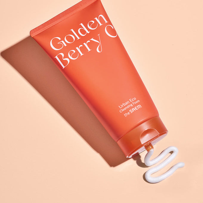THE SAEM Urban Eco Golden Berry C Cleansing Foam 150ml on beige background with product dispensed