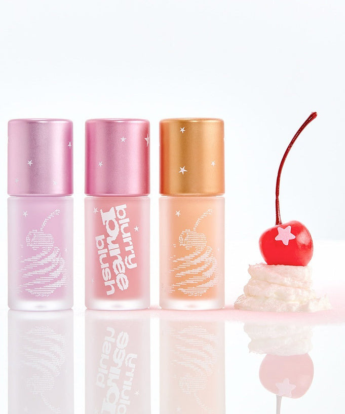 TIP TOE Blurry Puree Blusher bottles displayed with cherry and cream design, showcasing colorful cosmetic packaging.