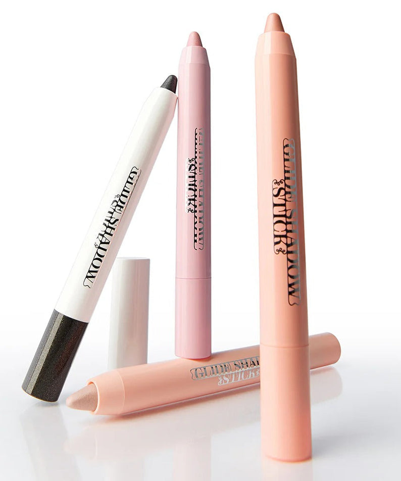TIP TOE Glide Shadow Stick in various colors for eye makeup application.