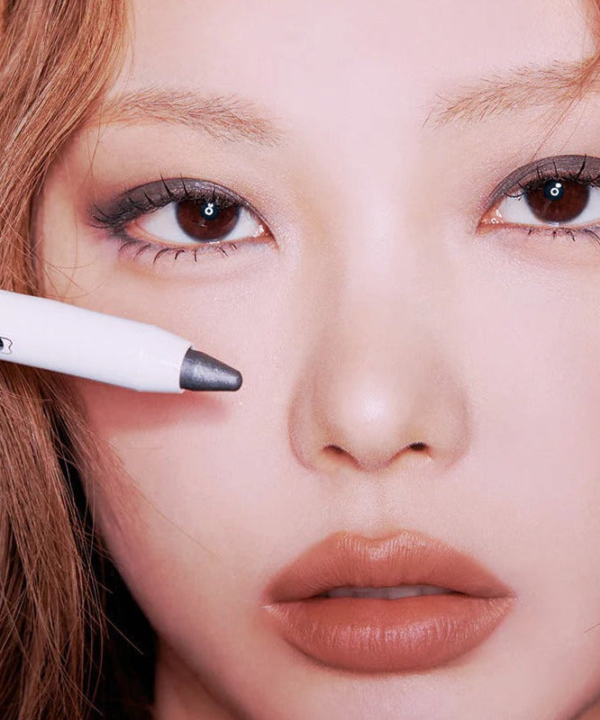 Model showcasing TIP TOE Glide Shadow Stick applied on eyes