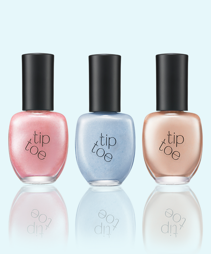 Three bottles of TIP TOE Matte Glitter Nail Polish in pink, blue, and beige shades displayed on a light background.