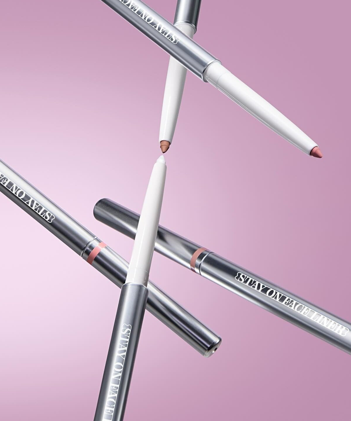 TIP TOE Stay On Face Liner makeup pencils on pink background