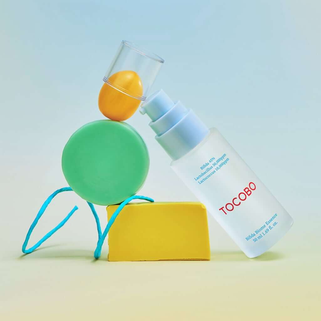 TOCOBO Bifida Biome Eessence product bottle with colorful abstract design background