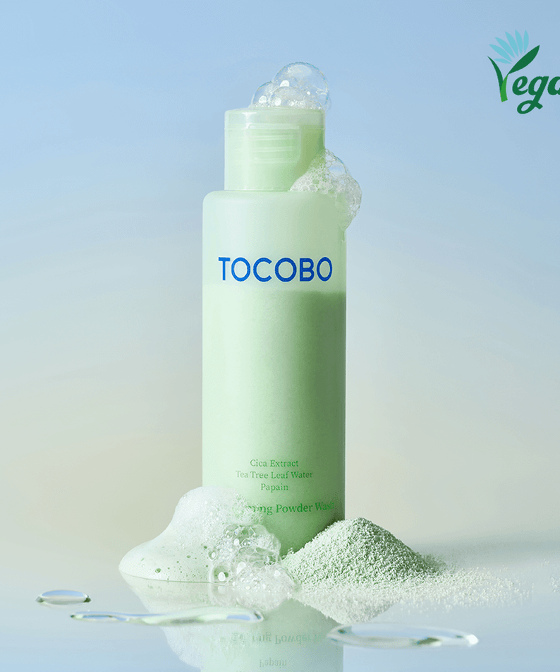 TOCOBO Cica Calming Powder Wash vegan skincare product with green bottle and powder scattered around
