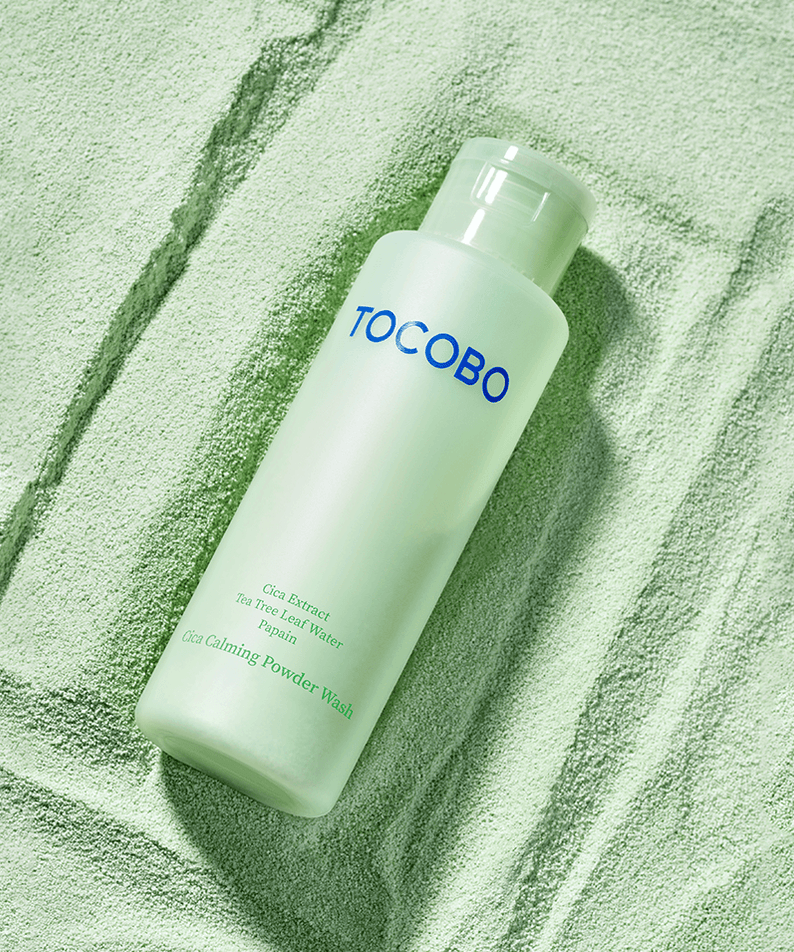 TOCOBO Cica Calming Powder Wash in green bottle against matching textured background