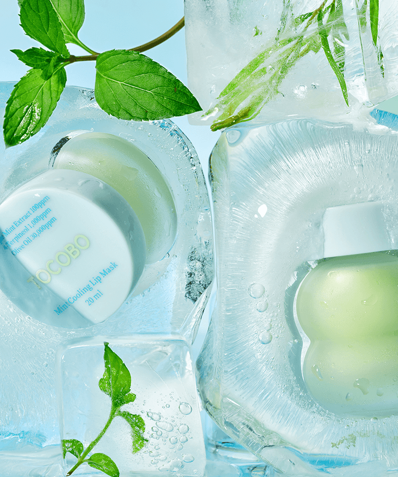 TOCOBO Mint cooling Lip Mask surrounded by ice, featuring mint leaves and icy background for refreshing care