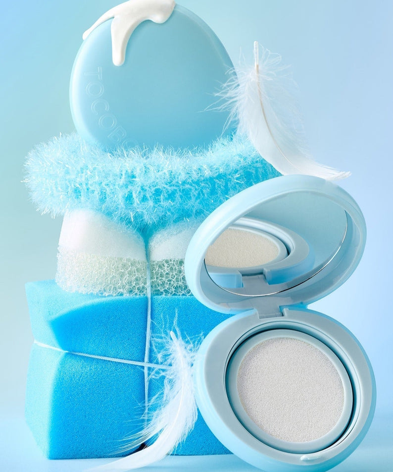 TOCOBO Blur Finish Sun Cushion with blue packaging and feathers, showcasing its protective sun-blocking and skin-smoothing attributes.