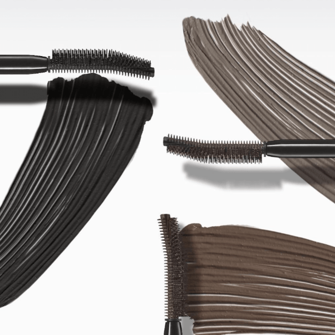 Close-up of TONY MOLY Eyetone Curl Correcting Mascara showing different brush styles and mascara shades.