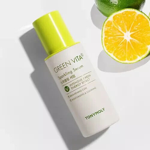 TONYMOLY Green Vita C Sparkling Serum 55ml with citrus fruit background