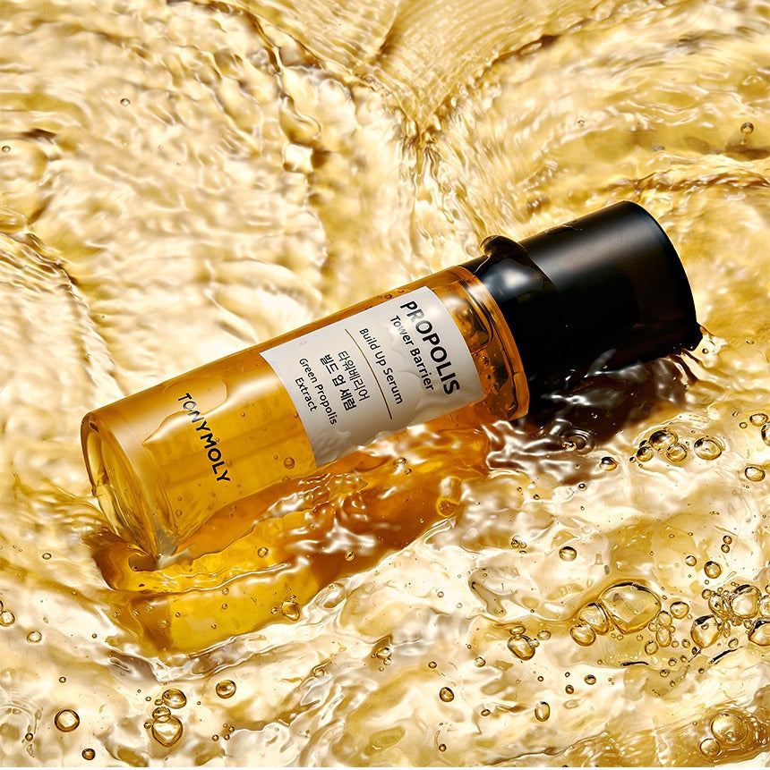 TONYMOLY Propolis Tower Barrier Build-up Serum 60ml bottle in golden liquid showcasing skincare product.