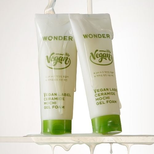 TONYMOLY Wonder Vegan Label Ceramide Mochi Midly Acidic Gel Foam 180g tubes with green caps on a wet surface.