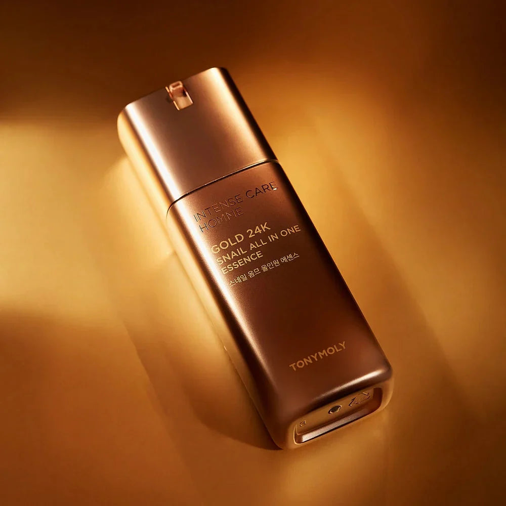 TONYMOLY Intense Care Gold 24K Snail Homme All-in-One Essence 130ml bottle on gold background for Gentleman Korea, Korean men’s skincare product