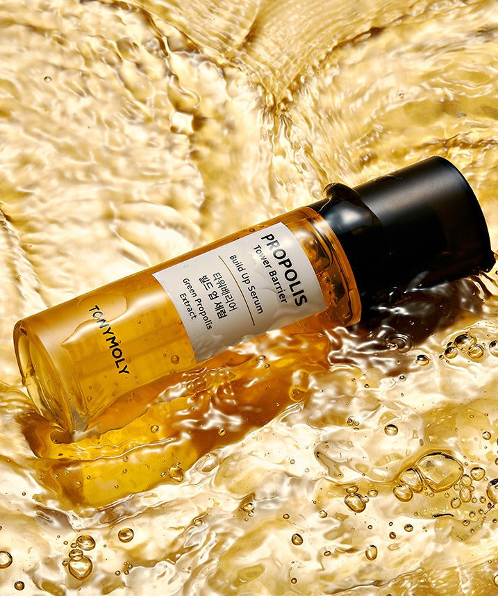 TONYMOLY Propolis Tower Barrier Build-up Serum 60ml bottle in golden liquid showcasing skincare product.