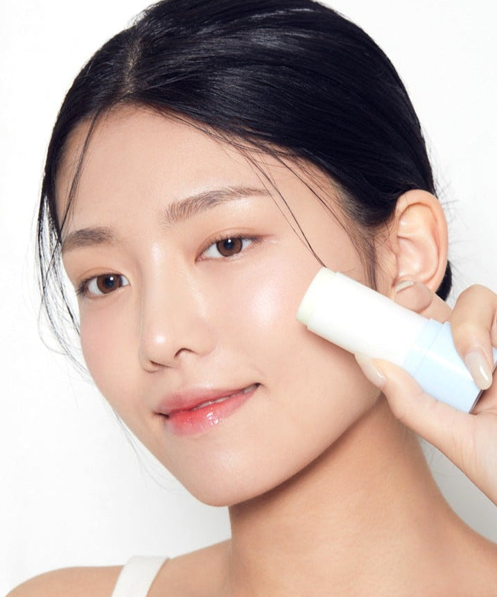Woman applying TONYMOLY UV Master Mild Moisture Sun Stick 20g on face for sun protection and skincare