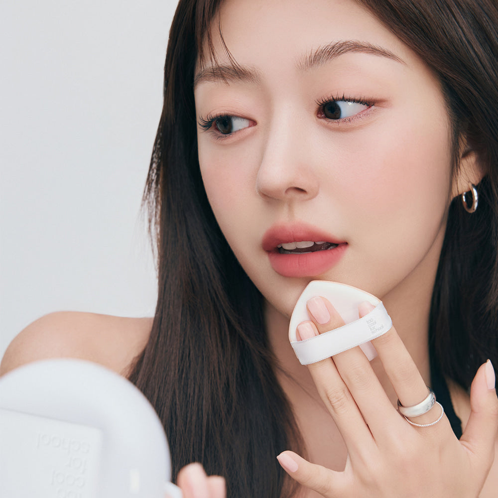 Woman applying TOO COOL FOR SCHOOL Fixing Cover Fit Cushion [Product + Refill] with compact in hand