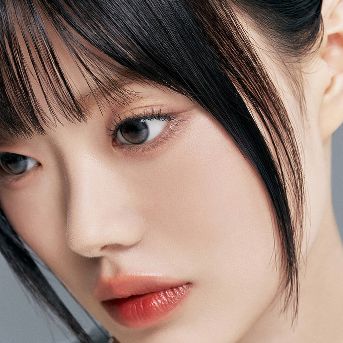 Close-up of person with flawless skin wearing TOO COOL FOR SCHOOL Fixing Nude Fit Cushion [Product + Refill] for a natural look.