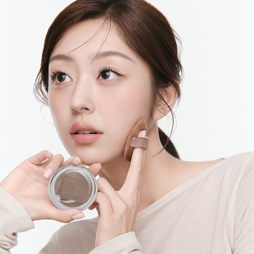 Woman applying TOO COOL FOR SCHOOL Veiled Contour makeup on face