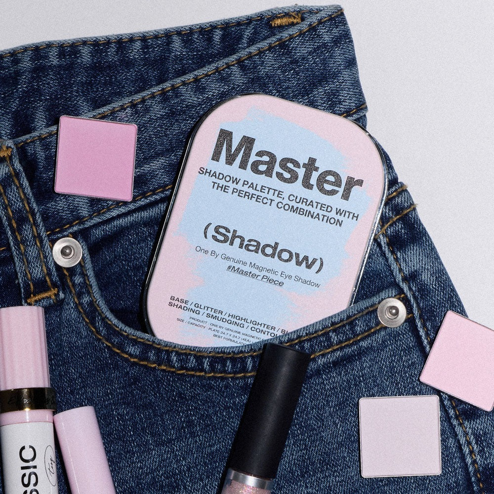 TOOQ Master Piece Face Shadow Palette nestled in denim with makeup accessories and pink eyeshadow squares.