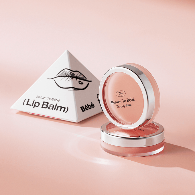 TOOQ Return To BÃ¨bÃ¨ Lip Balm in elegant packaging, featuring a sleek pink container and eye-catching design.