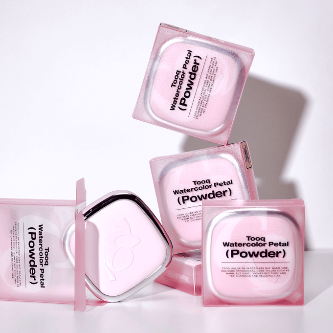 TOOQ Water Color Petal Powder packaging with multiple pink boxes stacked and open, showcasing the elegant design.
