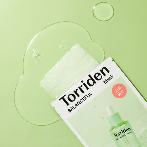 Image of TORRIDEN Balanceful Centella Asiatica Extract Mask with packaging on a green background.