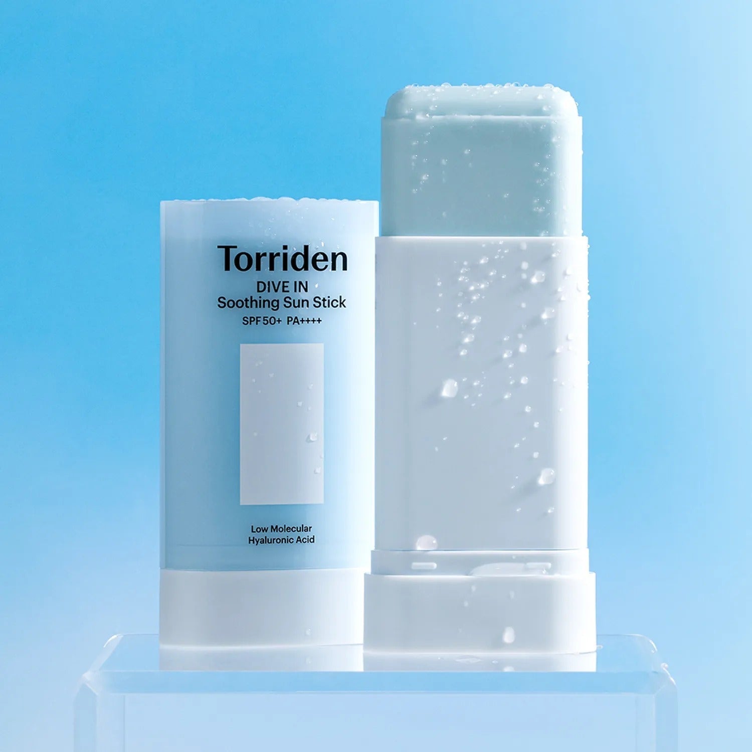 TORRIDEN Dive In Soothing Sun Stick SPF50+PA++++ 19g open and closed on blue background