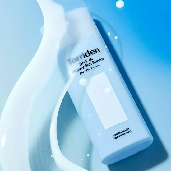 TORRIDEN Dive In Watery Sun Serum SPF50+PA++++ 50ml shown with splash of water on blue background.