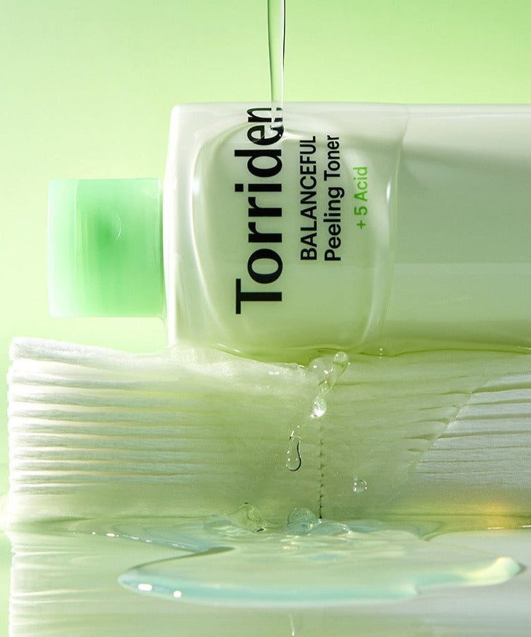 TORRIDEN Balanceful Peeling Toner 250ml bottle with liquid pouring, highlighting the product's hydrating and exfoliating properties.