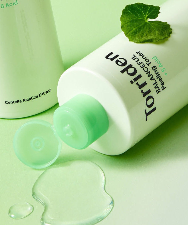 TORRIDEN Balanceful Peeling Toner 250ml bottle with liquid and leaf on green background