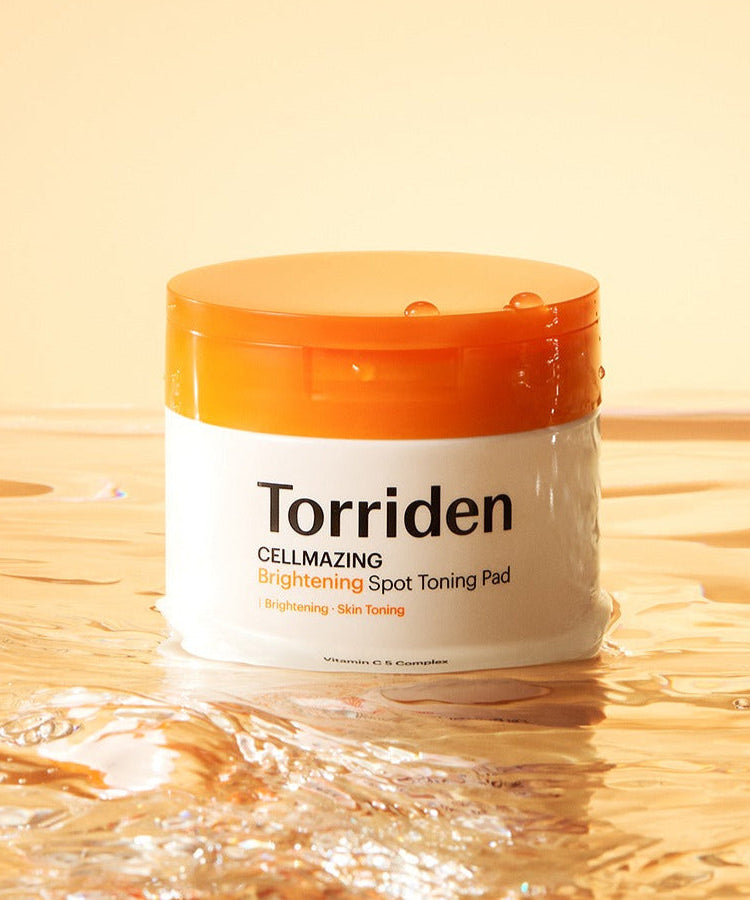 TORRIDEN Cellmizing Vita C brightening Trace Toning Pads 70 sheets in a water-themed setting.