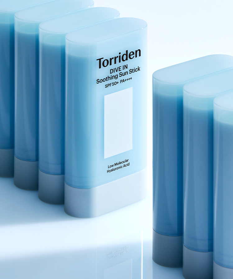 TORRIDEN Dive In Soothing Sun Stick SPF50+PA++++ 19g in multiple blue containers on a reflective surface.