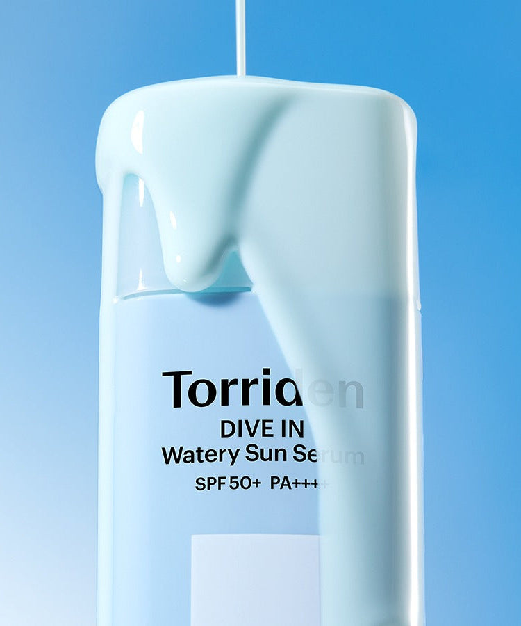 TORRIDEN Dive In Watery Sun Serum SPF50+PA++++ 50ml bottle with light blue serum against a blue background