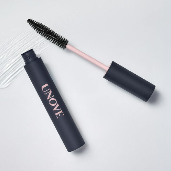 UNOVE Frizz Calming Slick Hair Finishing Stick 10ml with mascara brush on white background