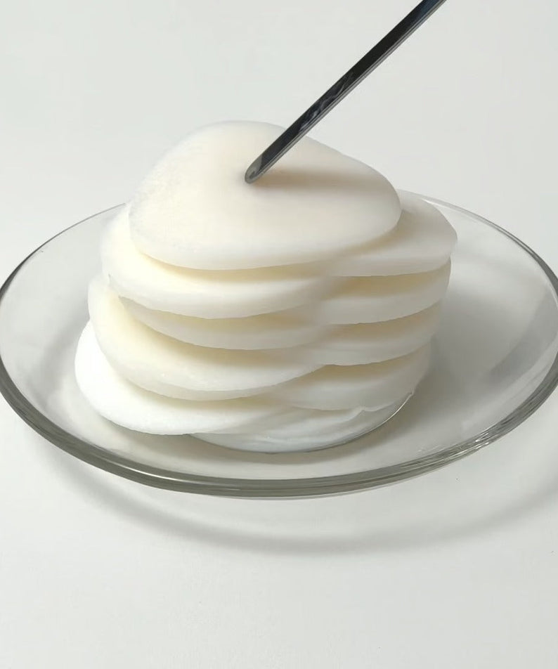 UNPA Lacto Cica Deep Calming Serum Pad 85 Sheets on a glass plate