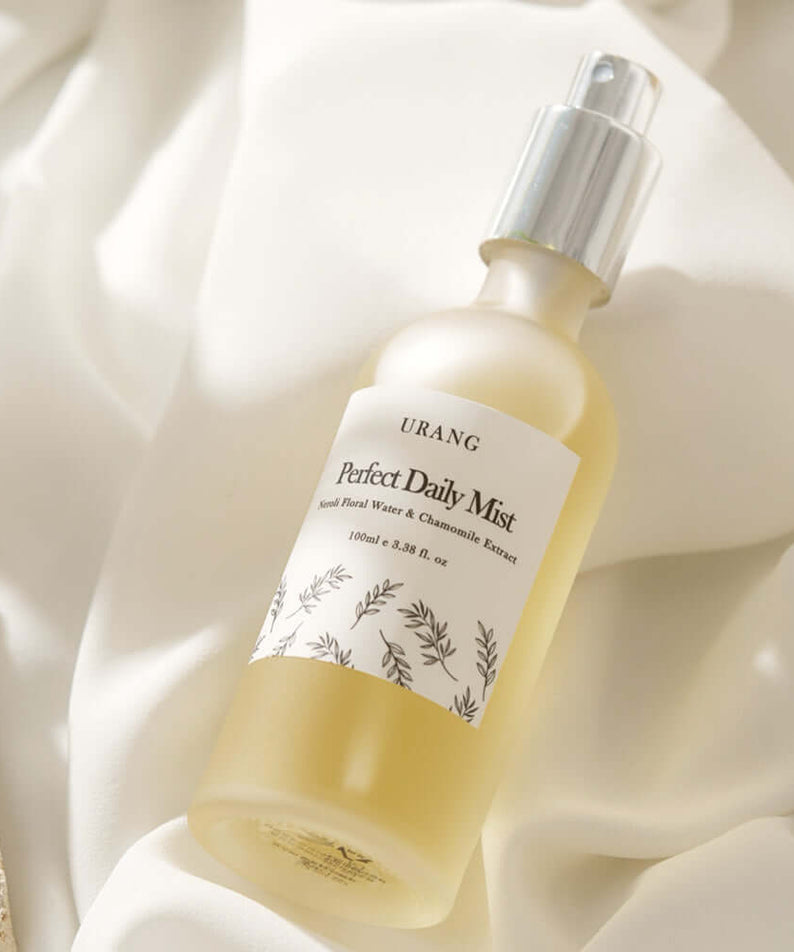 URANG Perfect Daily Mist 100ml bottle against a soft fabric background