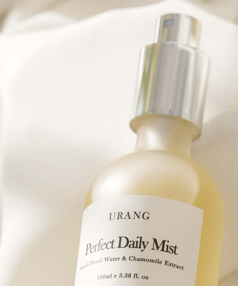 URANG Perfect Daily Mist 100ml bottle on a soft fabric background