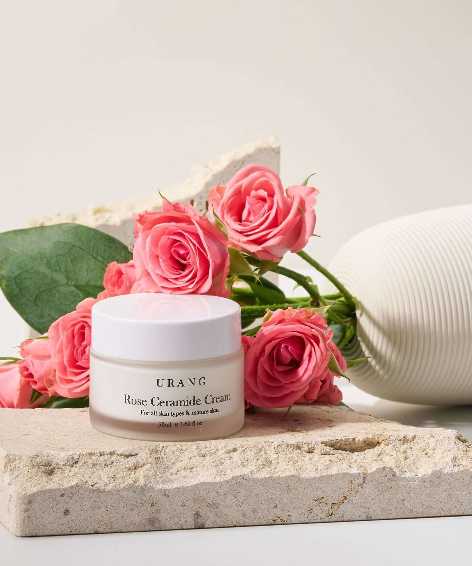URANG Rose Ceramide Cream 50ml jar with pink roses, highlighting skincare benefits.