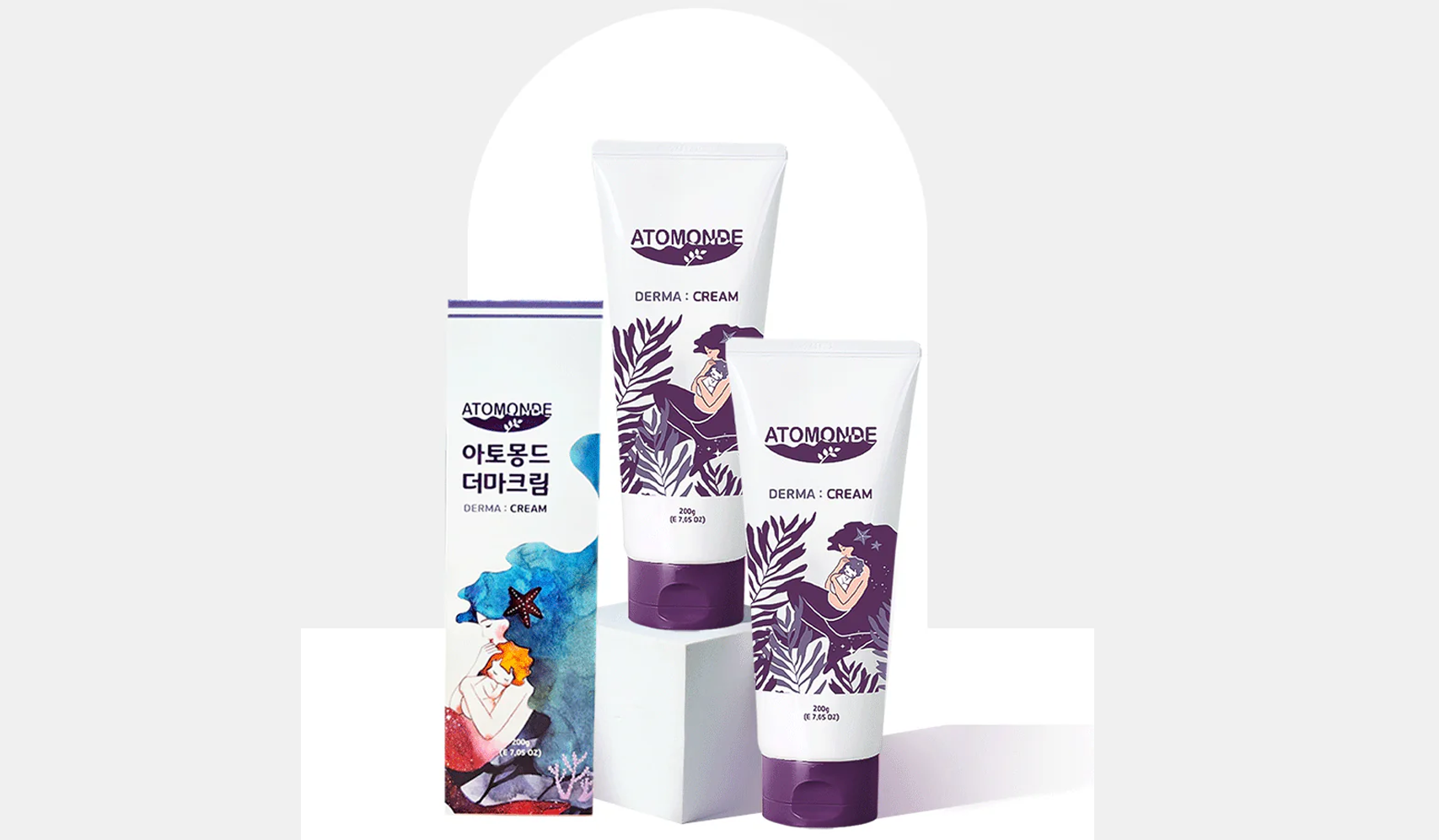 AtoMonde Derma Cream packaging with two tubes and a box displaying colorful graphics, designed for skin care.