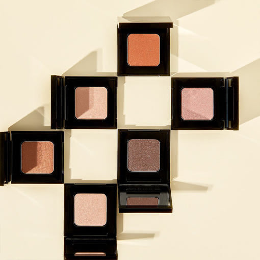 Collection of VIDIVICI Single Eye Shadow in various shades, neatly arranged in a cross pattern on a light background.