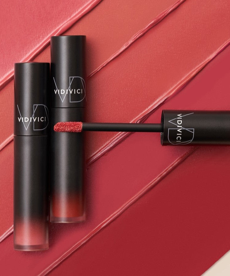 VIDIVICI Millennial Tint Velvet lip products shown with vibrant red shades on textured background.